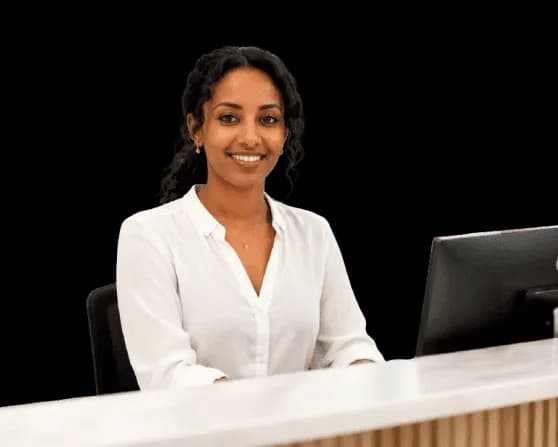 Receptionist at the Swetral Medium Clinic front desk